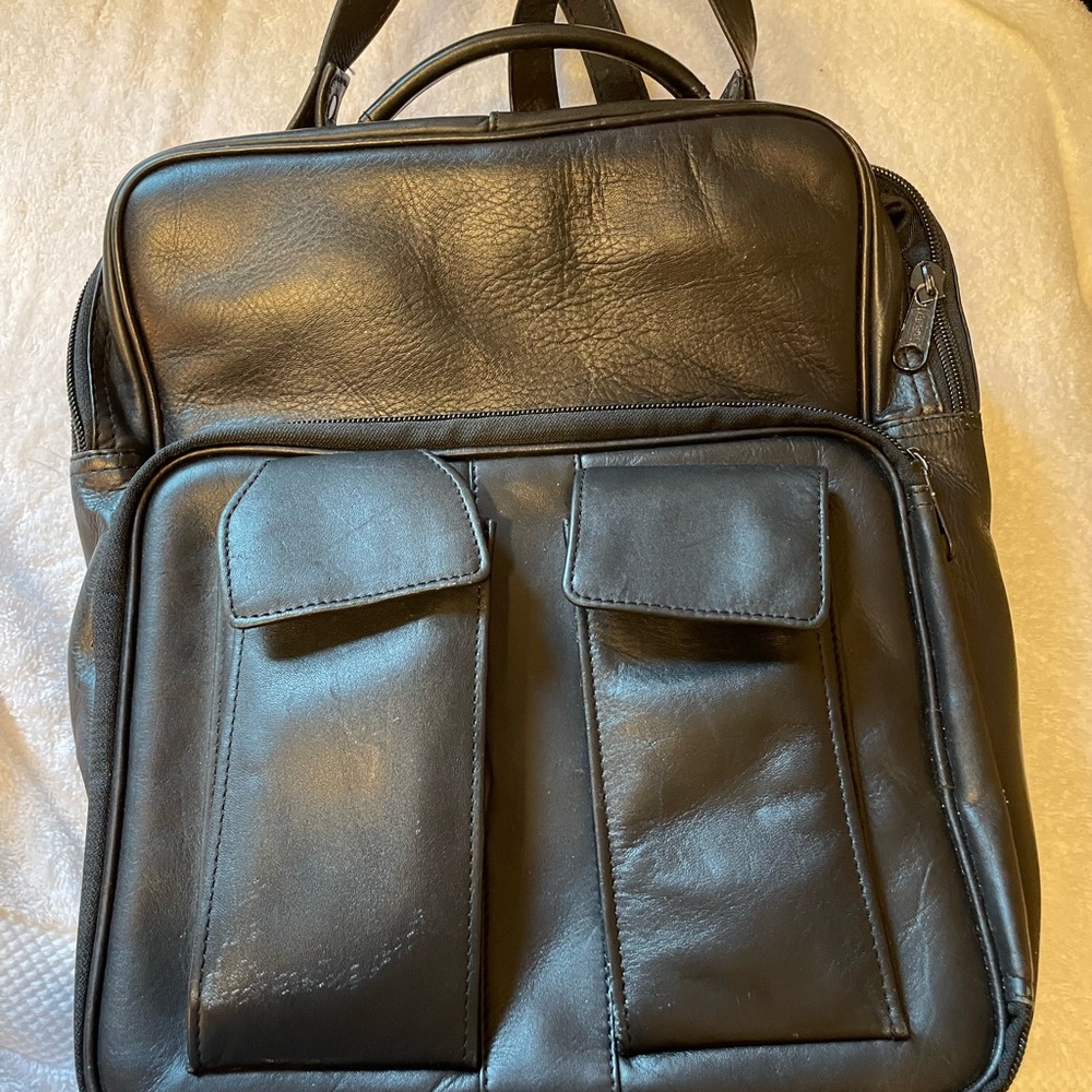 Great leather Messenger/backpack/laptop bag.